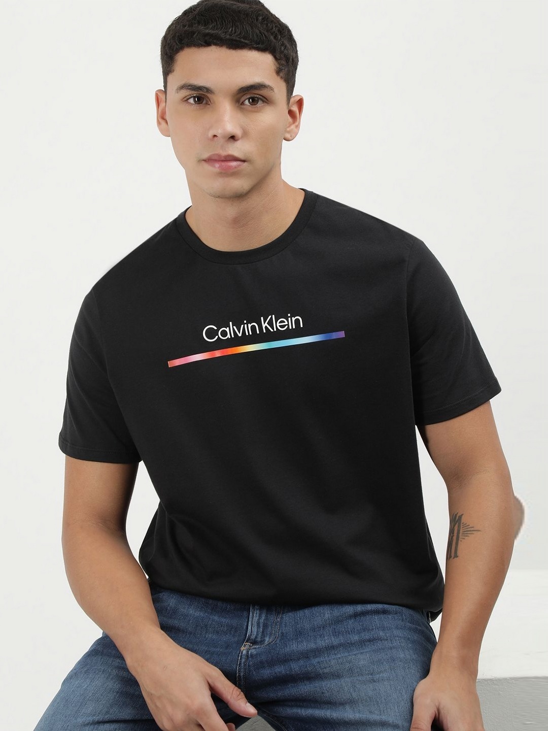 

Calvin Klein Jeans Men Solid Round Neck Cotton T-shirt, Black