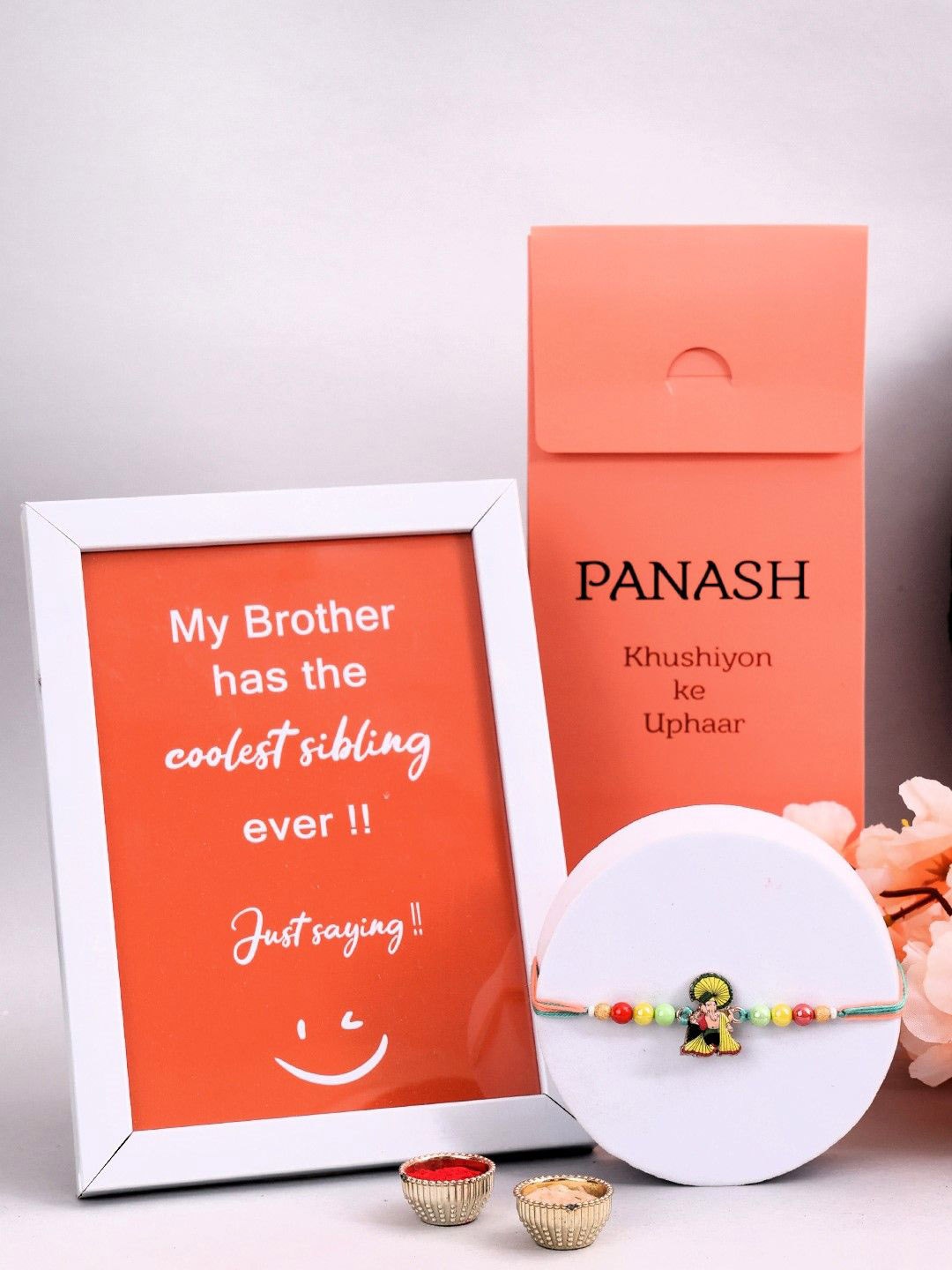 

PANASH Set Of 2 Lord Ganesha Rakhi With Photo Frame And Roli Chawal, Gold