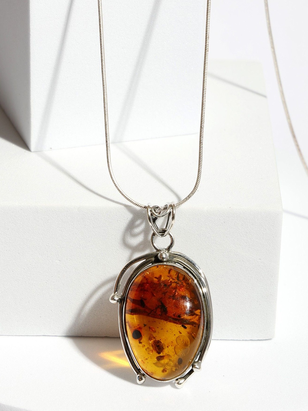 

Exotic India Amber Cabochon Stone Oval Sterling Silver Pendant