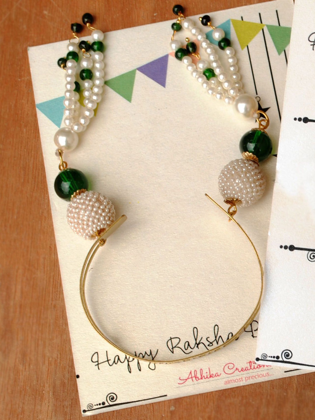 

BeAbhika Beaded Stainless Steel Lumba Rakhi with Roli Chawal, Gold