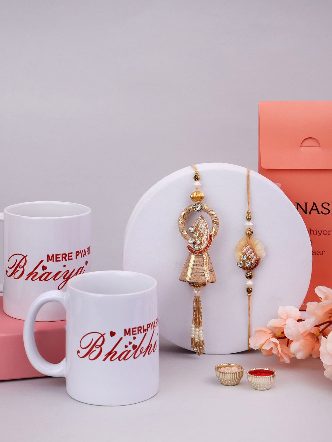 

PANASH 2 Pcs Rakhi With 2 Pcs Mug & Roli Chawal Gift Set, Gold