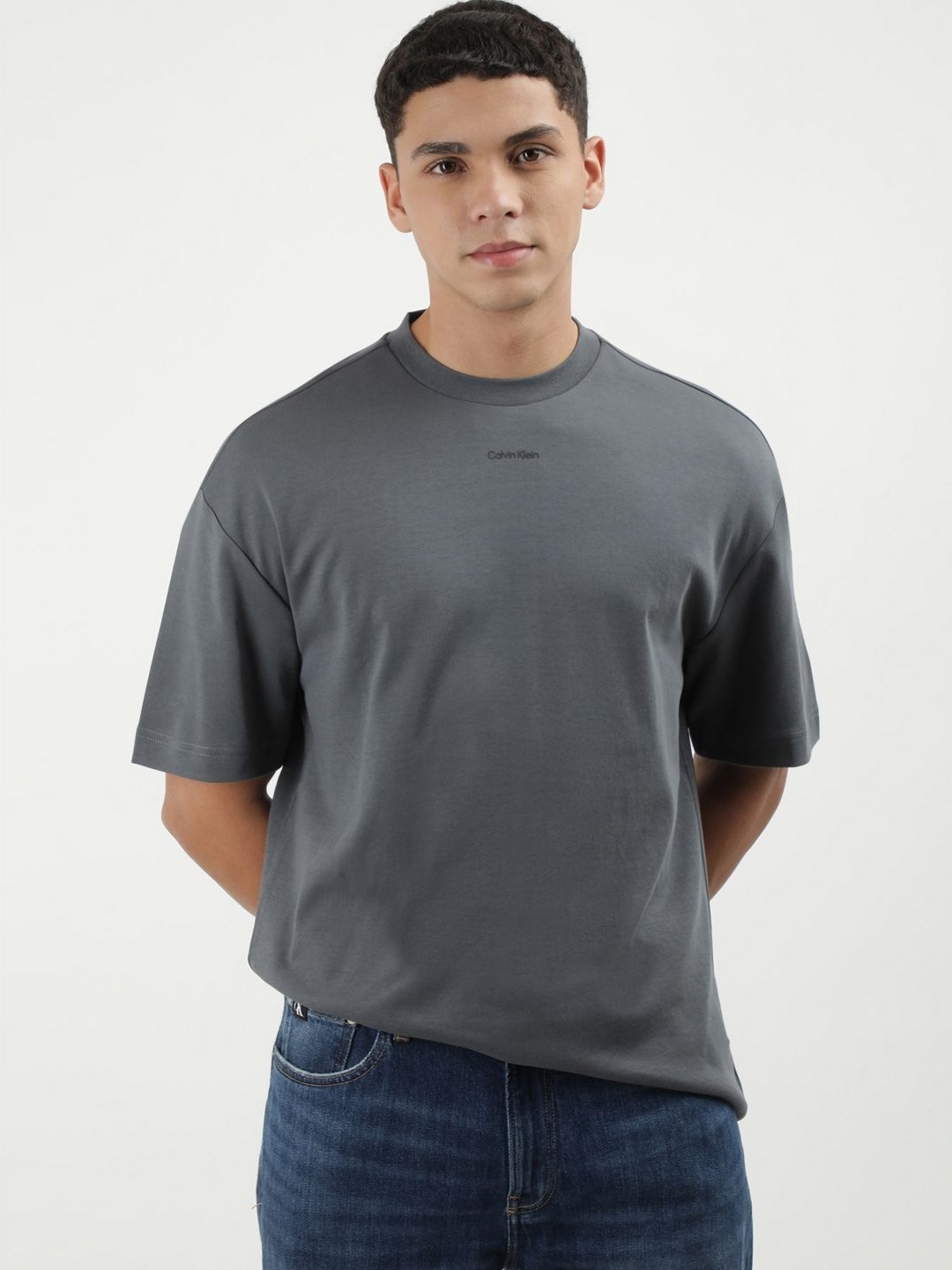 

Calvin Klein Jeans Men Solid Round Neck Cotton T-shirt, Grey
