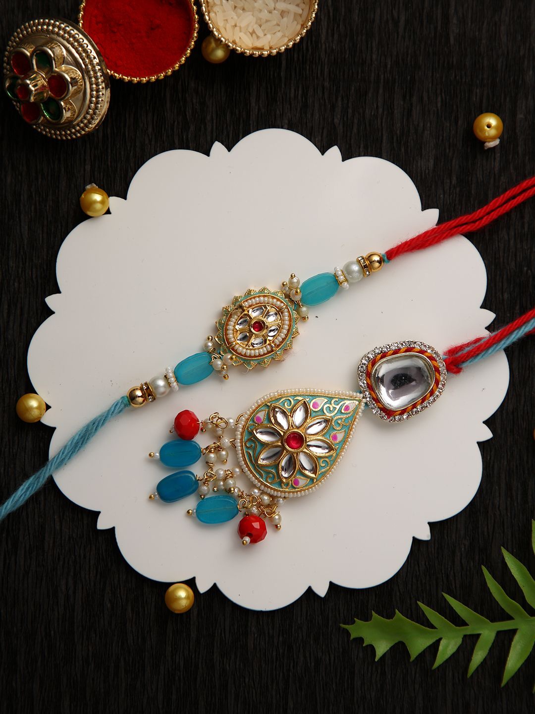 

Anouk Bhaiya Bhabhi Kundan Studded Enameled Thread Rakhi With Roli Chawal & Greetings Card, Gold