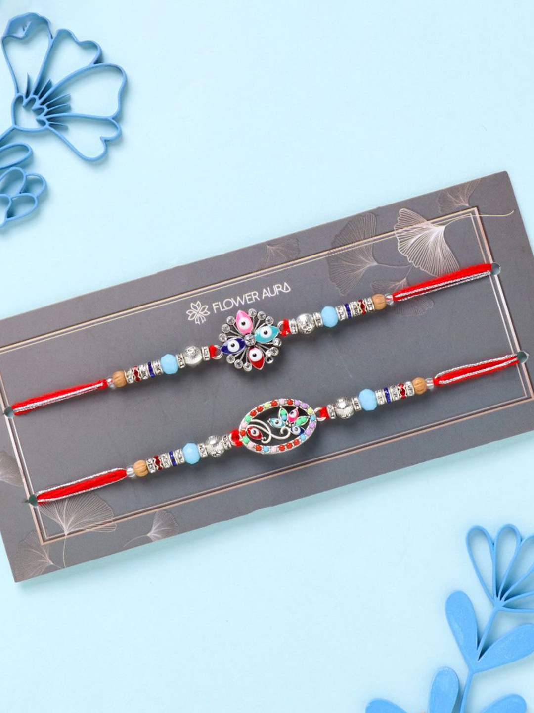 

Floweraura Set of 2 Studded Evil Eye Charm Rakhi Bracelet With Roli Chawal, Red