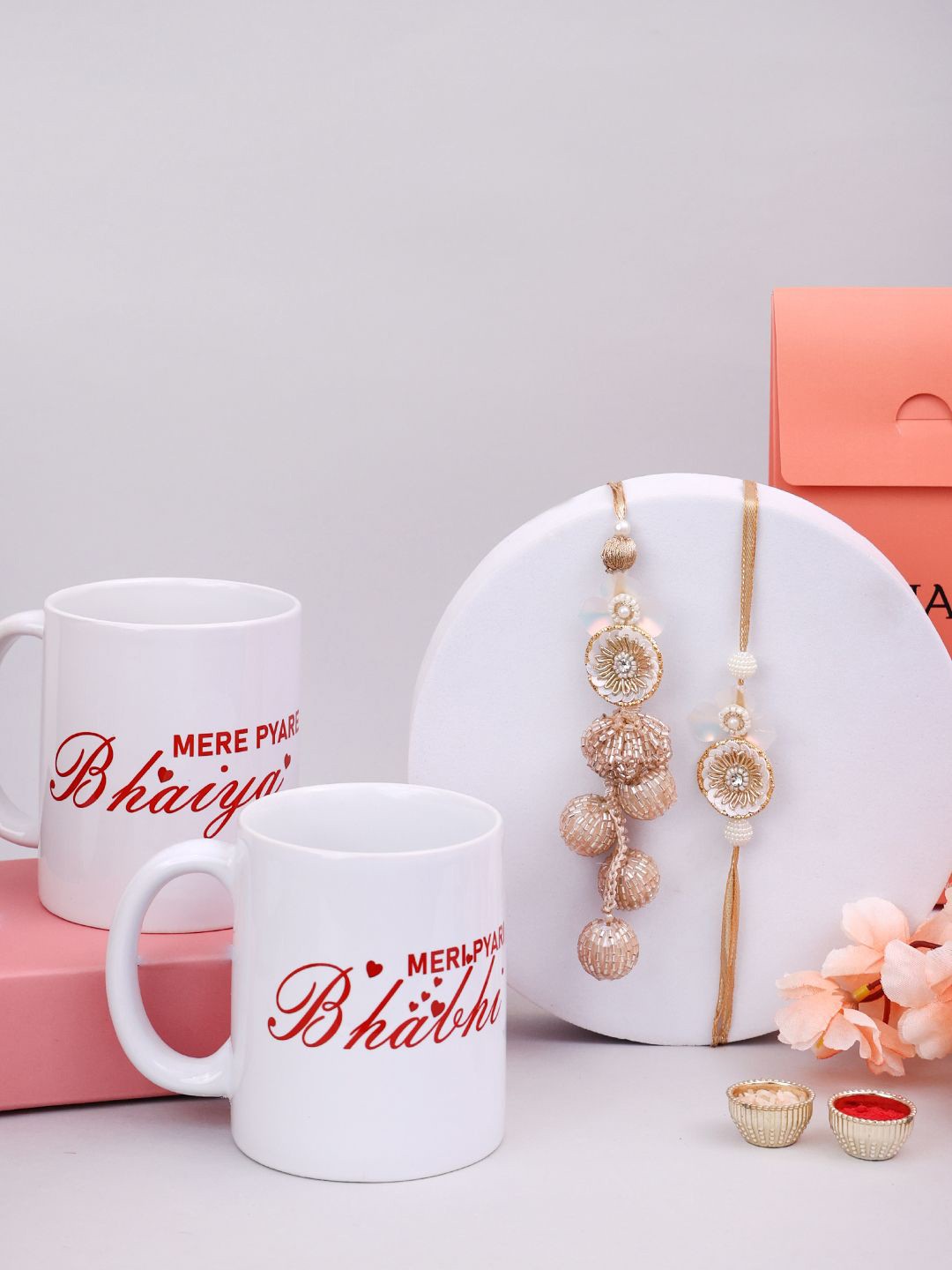 

PANASH Beaded Bhaiya and Bhabhi Rakhi With Mere Pyaare Mugs And Roli Chawal, Gold