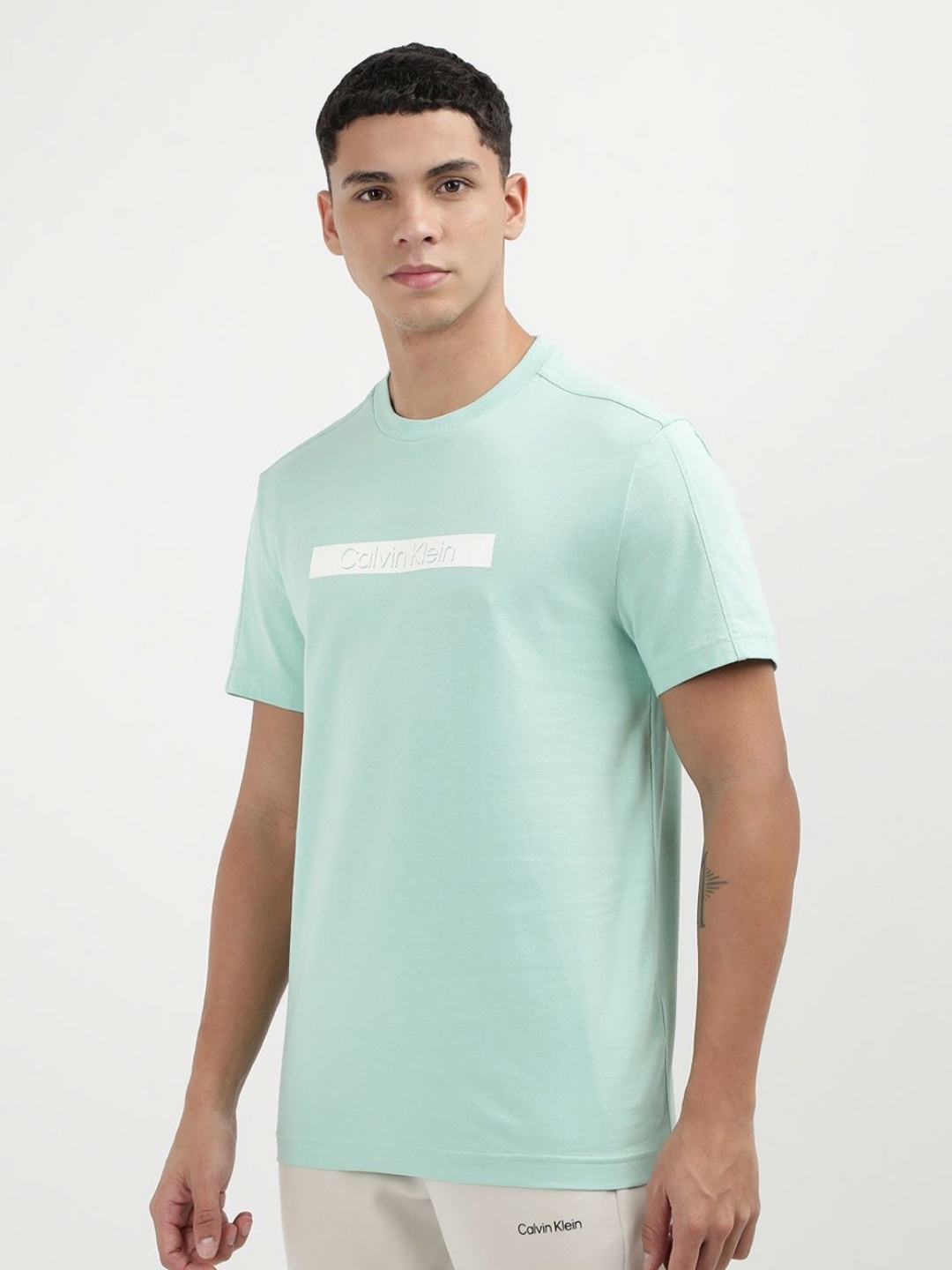 

Calvin Klein Jeans Men Solid Round Neck Cotton T-shirt, Green