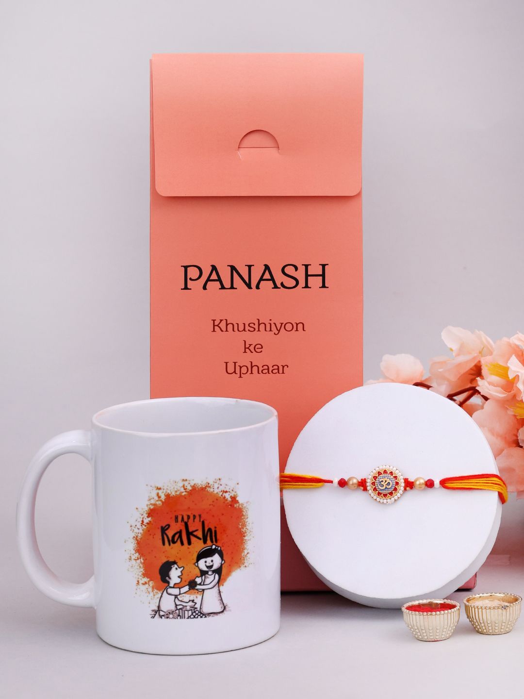 

PANASH Set Of 2 Beaded Rakhi With Printed Mug And Roli Chawal, Beige