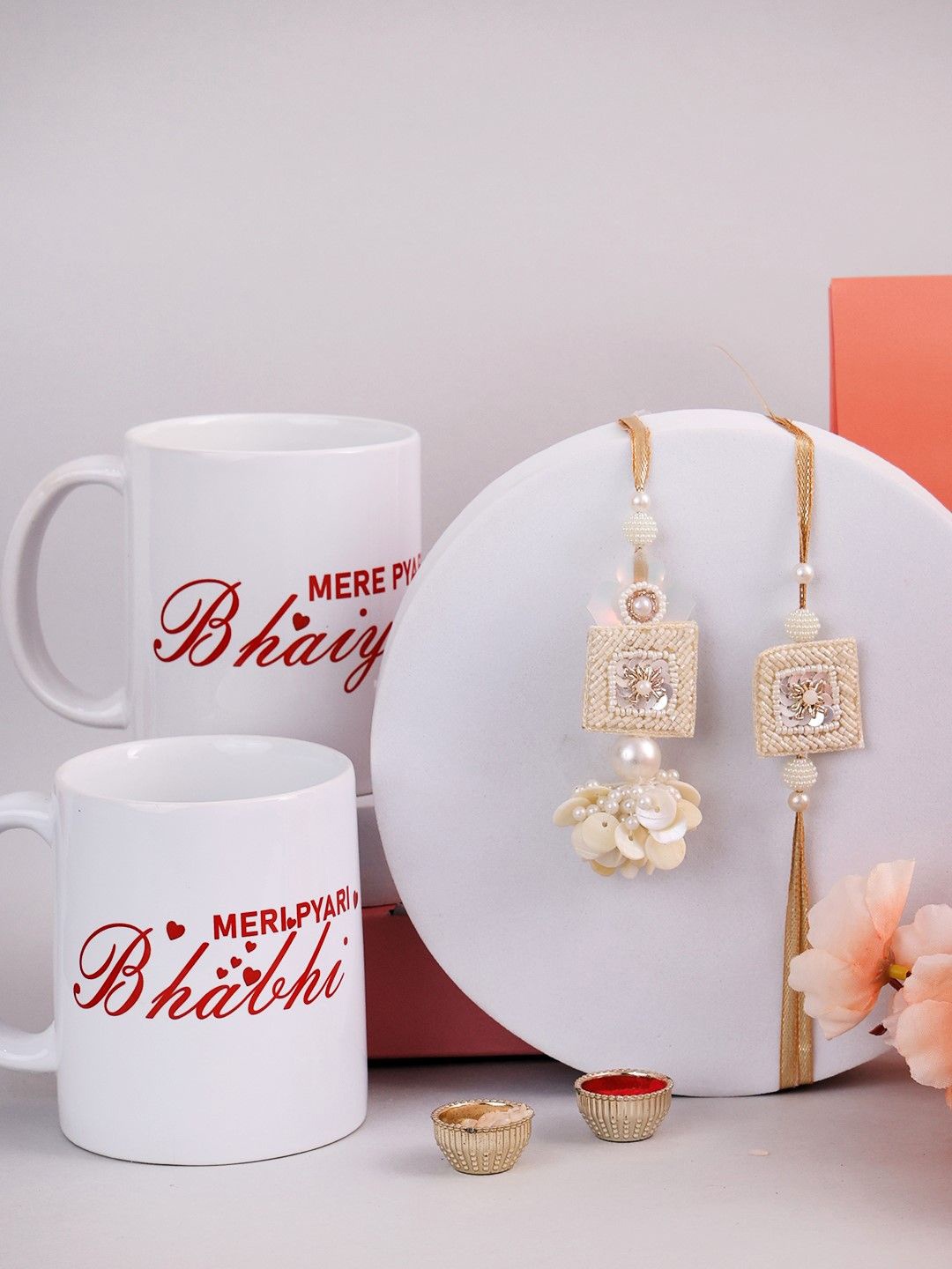 

PANASH Set of Rakhis Gift Set With Mugs & Roli Chawal, Gold