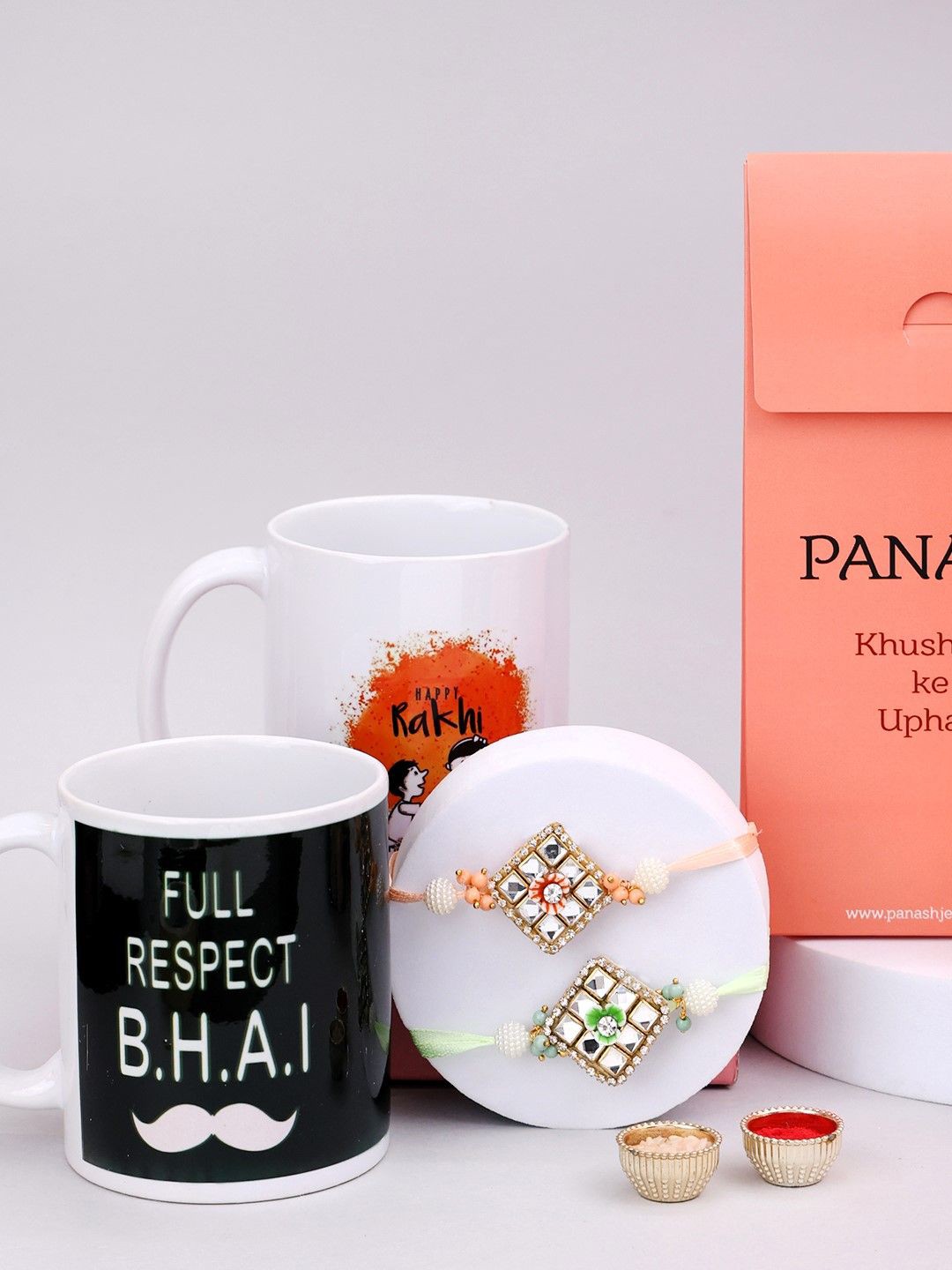 

PANASH Set Of 4 Beaded Rakhi With Printed Mugs & Roli Chawal, Gold