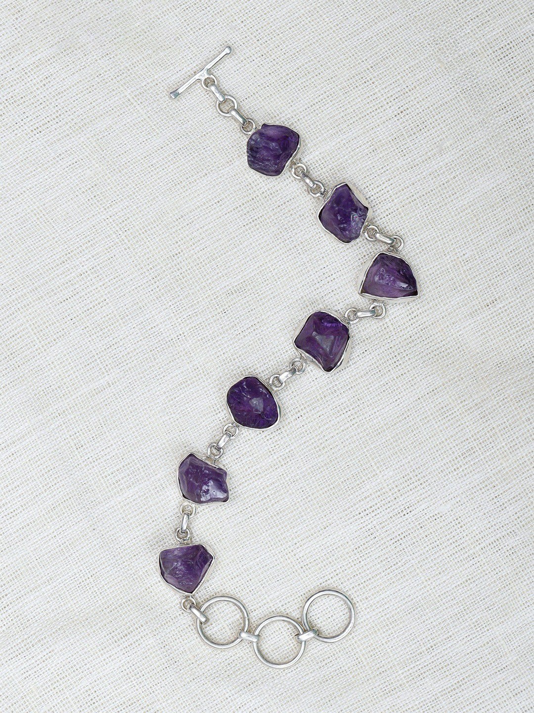 

Exotic India Sterling Silver Amethyst Silver Plated Charm Bracelet