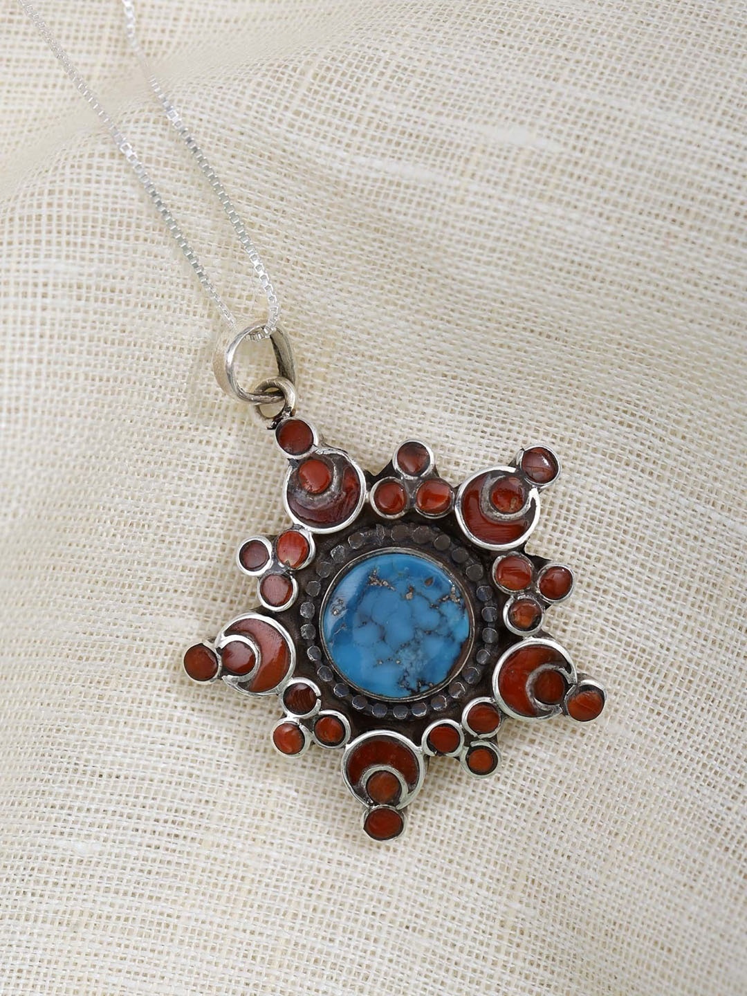 

Exotic India Turquoise and Coral Sterling Silver Floral Design Pendant