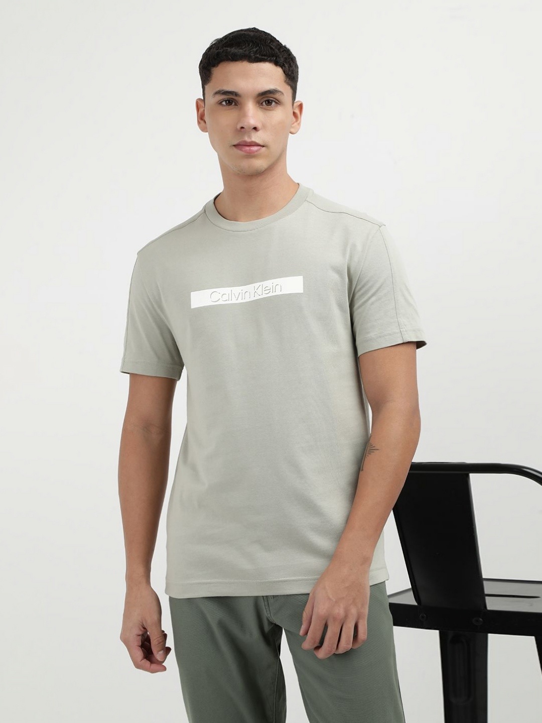 

Calvin Klein Jeans Men Solid Round Neck Cotton T-shirt, Beige