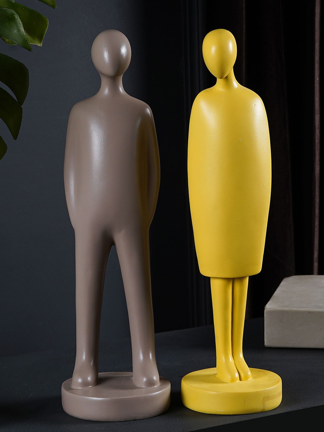 

THE ARTMENT Set of 2 Yellow & Brown Decorative Human Couple Stand Polyresin Showpiece