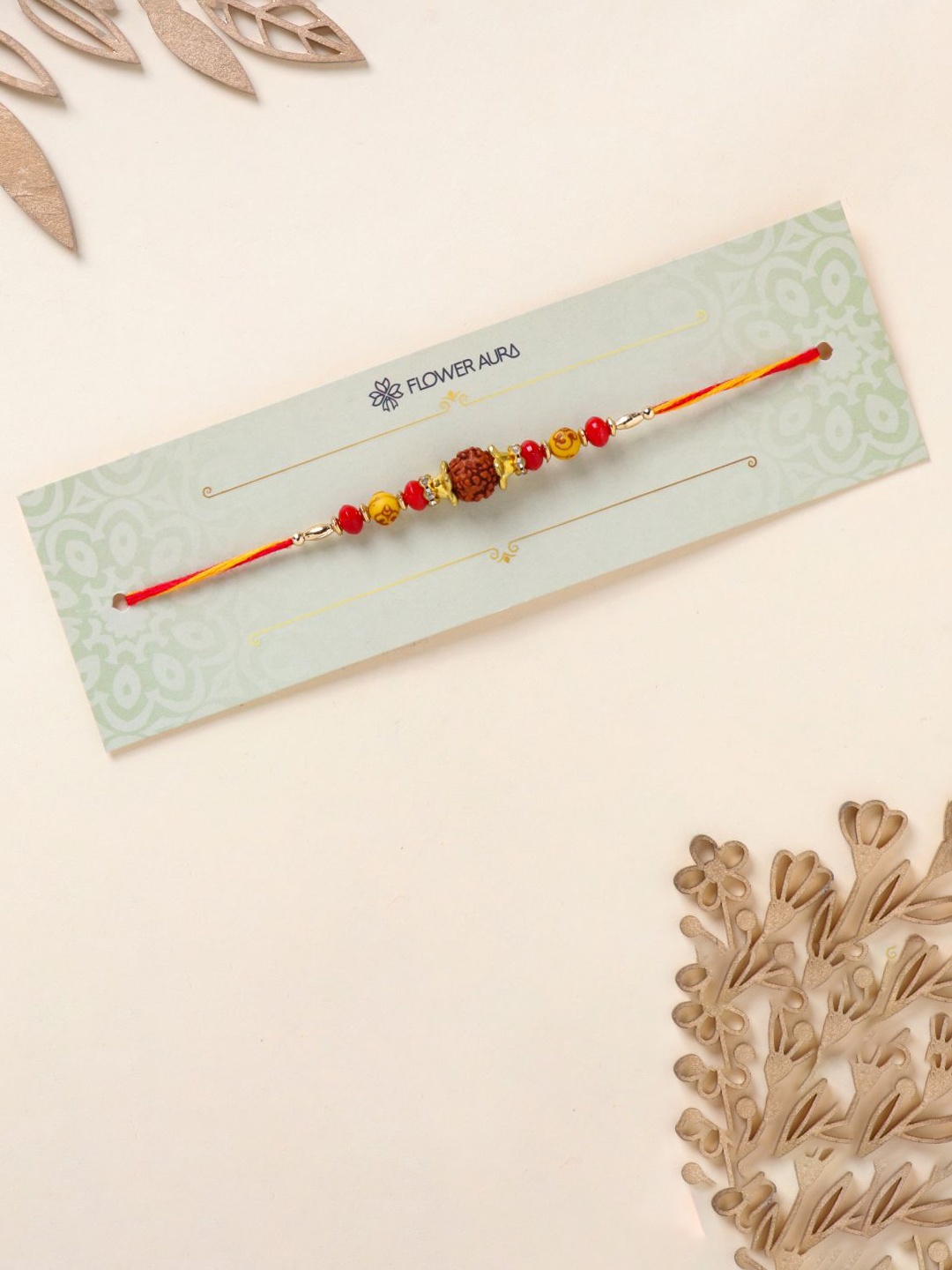 

Floweraura Rudraksha Stone Studded & Beaded Thread Rakhi With Roli Chawal, Gold