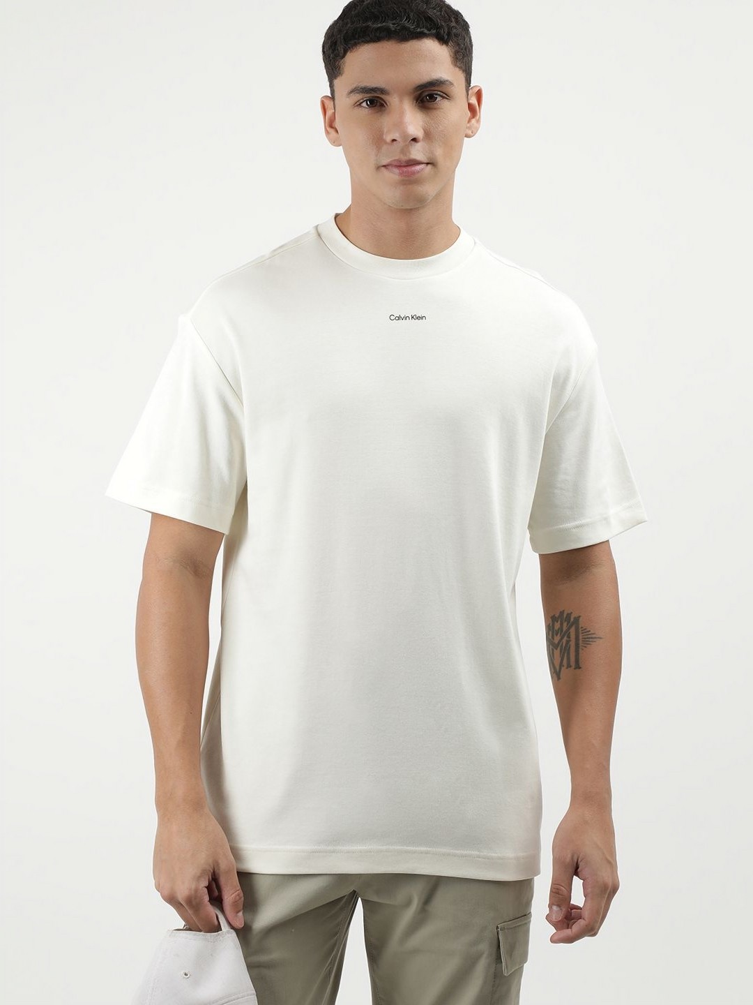 

Calvin Klein Jeans Men Solid Round Neck Cotton T-shirt, Off white