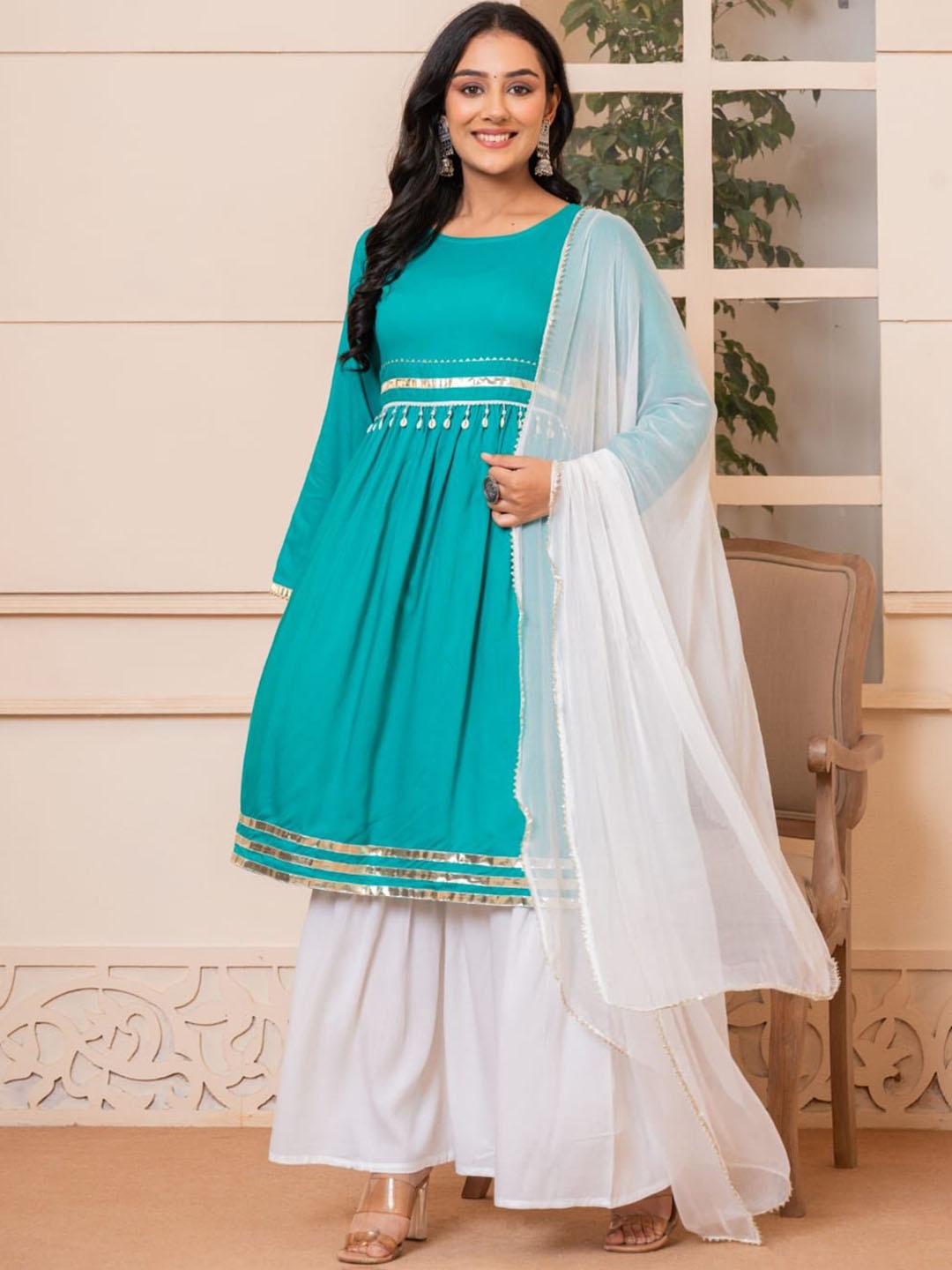 

SHOOLIN Women Regular Beads and Stones Kurta with Sharara & With Dupatta, Turquoise blue