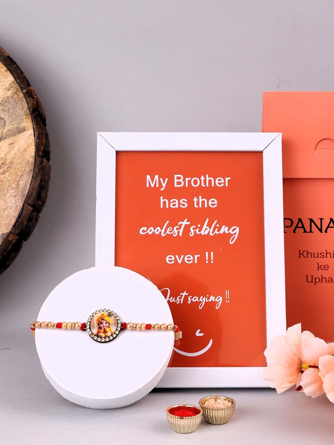 

PANASH Set Of 2 Krishna Stone-Studded & Beaded Rakhi With Roli Chawal & Photo Frame, Red