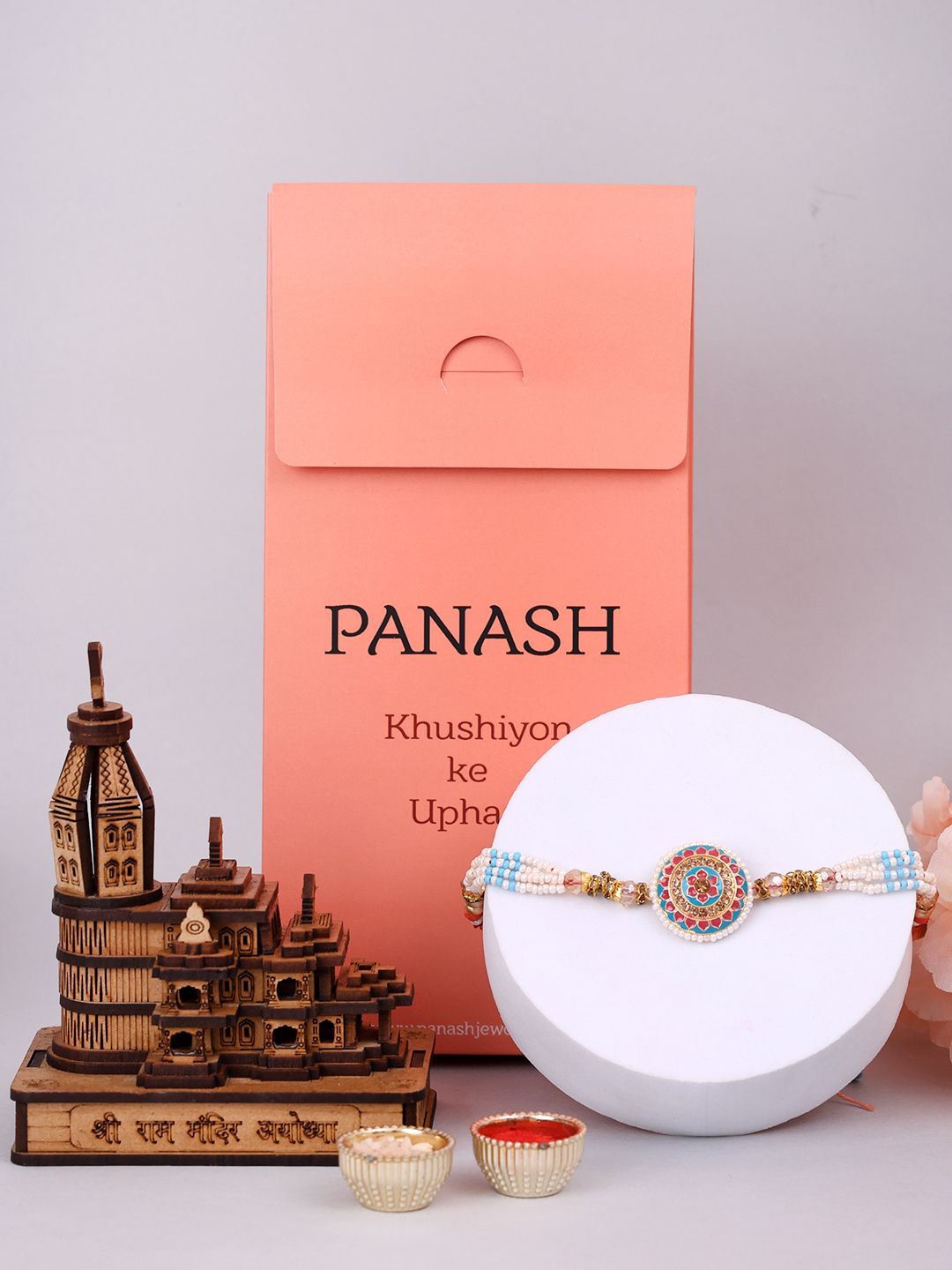 

PANASH Stone Studded & Beaded Rakhi With Roli Rice & Showpiece, Red