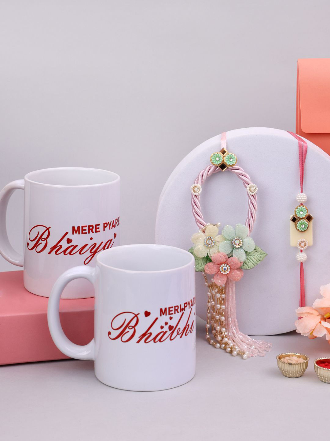 

PANASH Set of 2 Bhaiya and Bhabhi Rakhi with Mugs and Roli Chawal, Gold