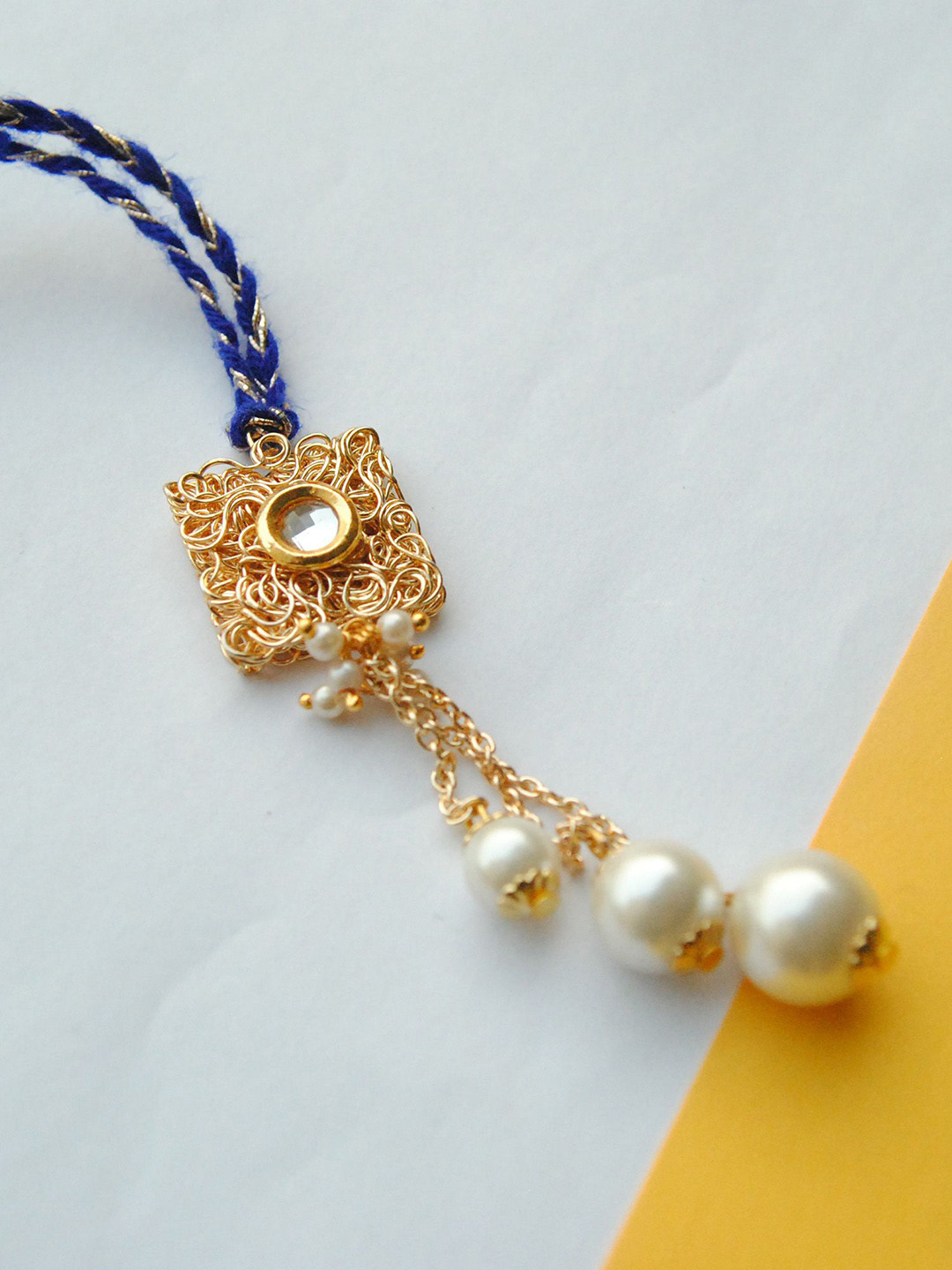 

BeAbhika Square Golden Mesh & Dangling Pearls Beaded Lumba Rakhi With Roli & Chawal, Gold