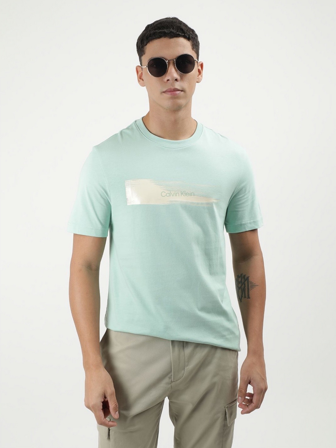 

Calvin Klein Jeans Men Graphic Printed Round Neck Cotton T-shirt, Green