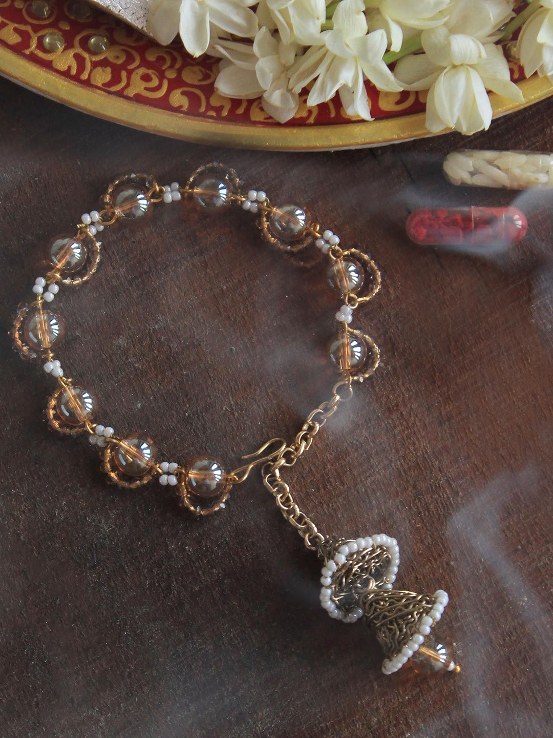 

BeAbhika Sheeny Beaded Bracelet Lumba Wraparound Rakhi With Roli Chawal, Gold