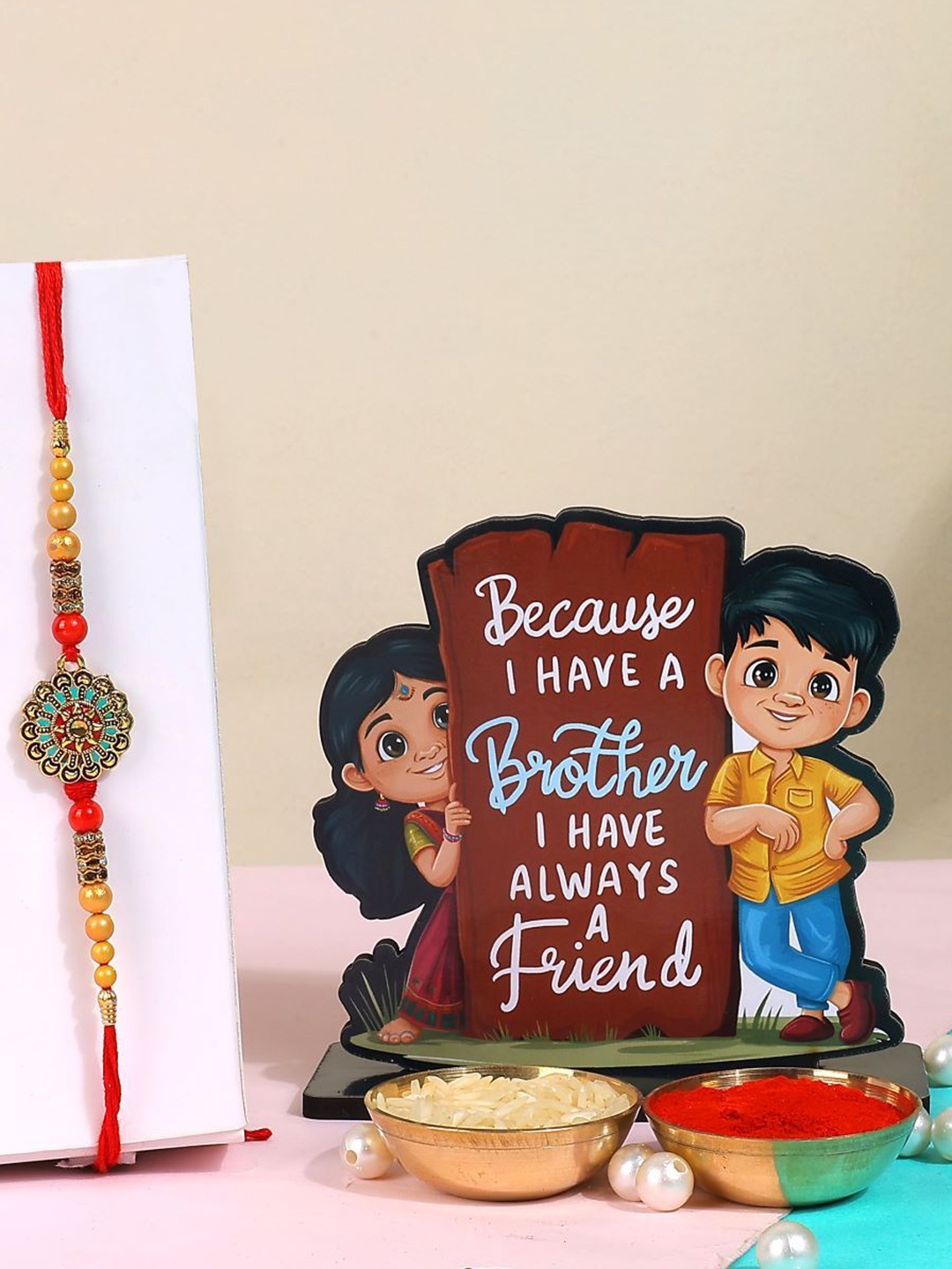 

Phirki Studio Set of 2 Beaded Thread Rakhi With Brosis Table Stand & Roli Chawal, Gold