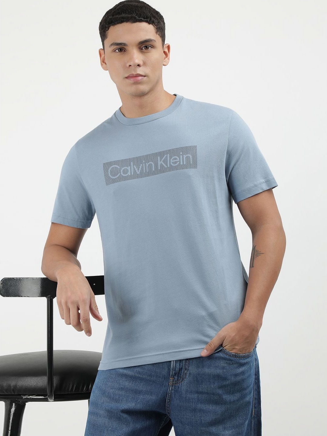 

Calvin Klein Jeans Men Solid Round Neck Cotton T-shirt, Blue