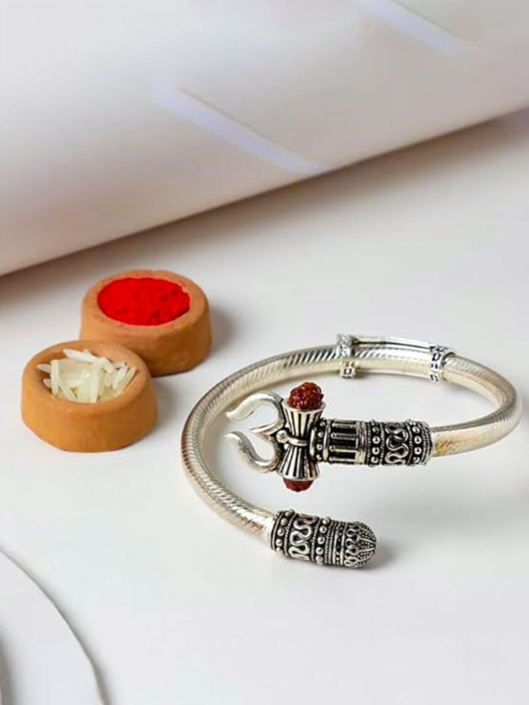 

Floweraura Rudraksh Beaded Silver Rakhi with Roli Chawal