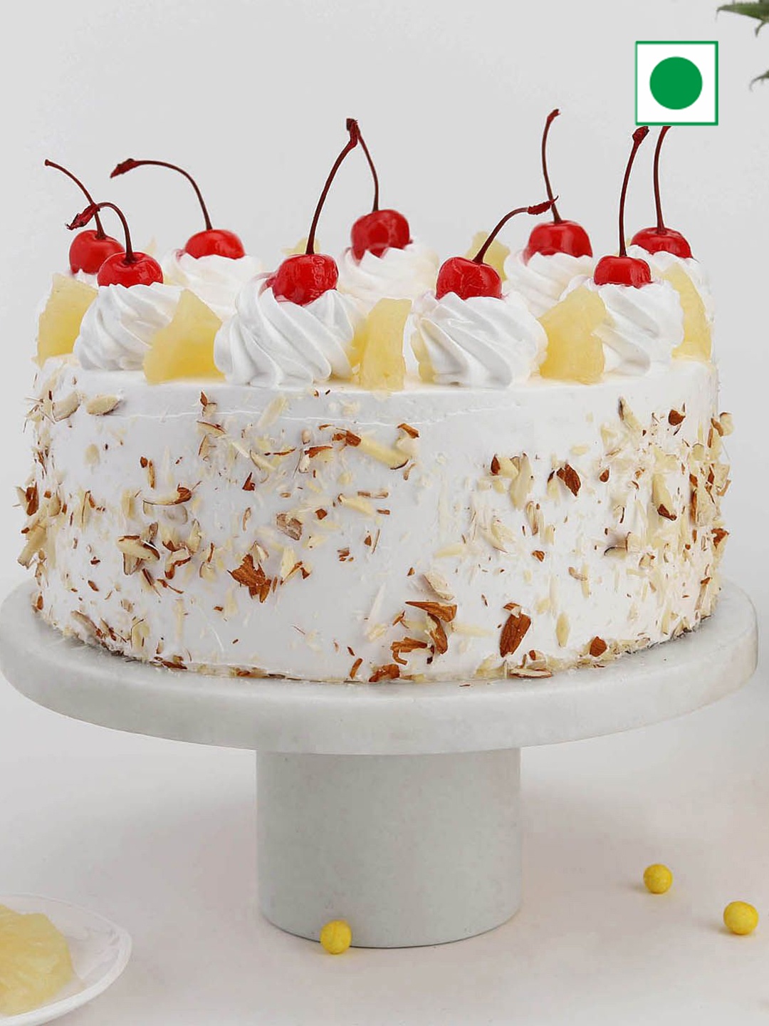 

IGP Delicious Pineapple Flavour Eggless Round Cake - Half Kg, White