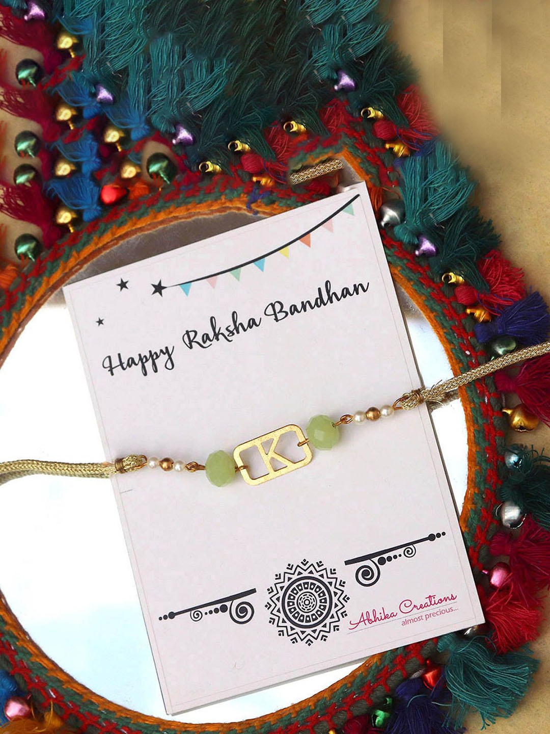 

BeAbhika K Initial Beaded Thread Rakhi With Roli Chawal, Gold