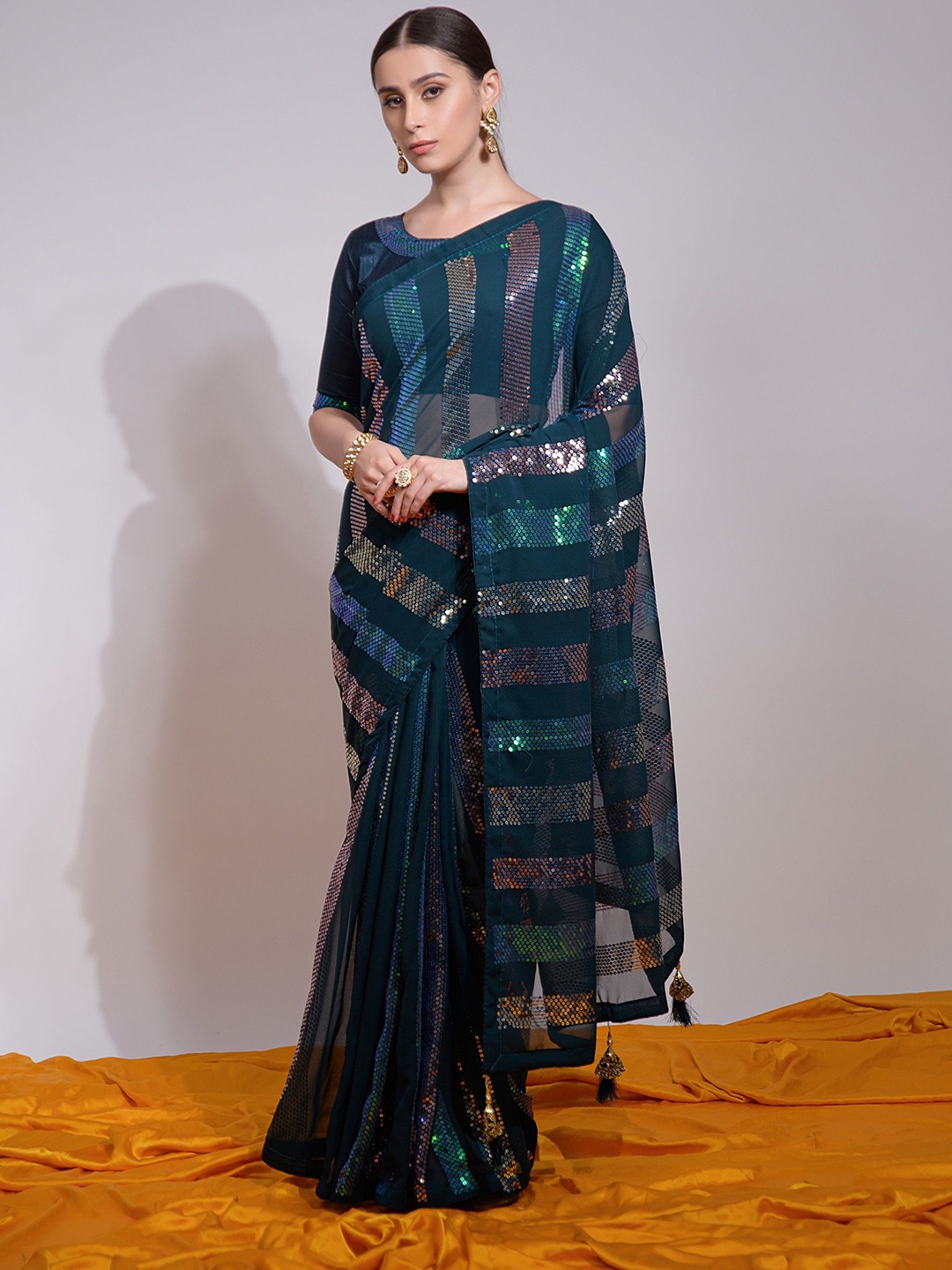 

QVAZOR Embellished Sequinned Pure Georgette Saree, Teal