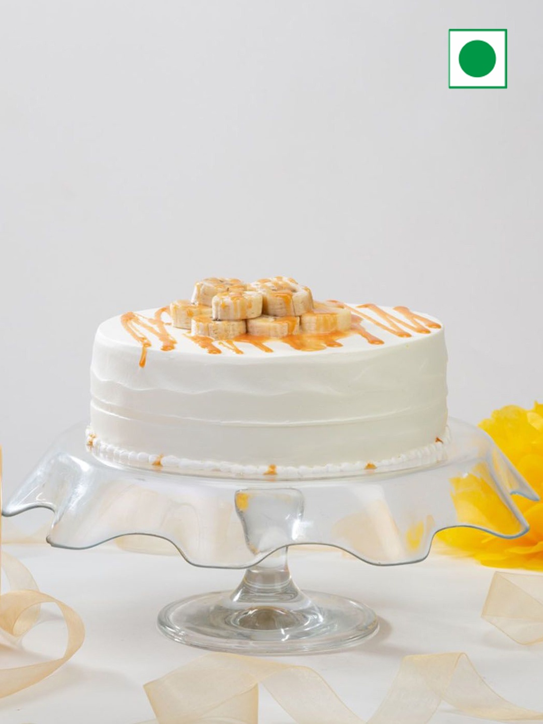 

IGP Fruity Banana Caramel Flavour Eggless Round Cake - Half Kg, White
