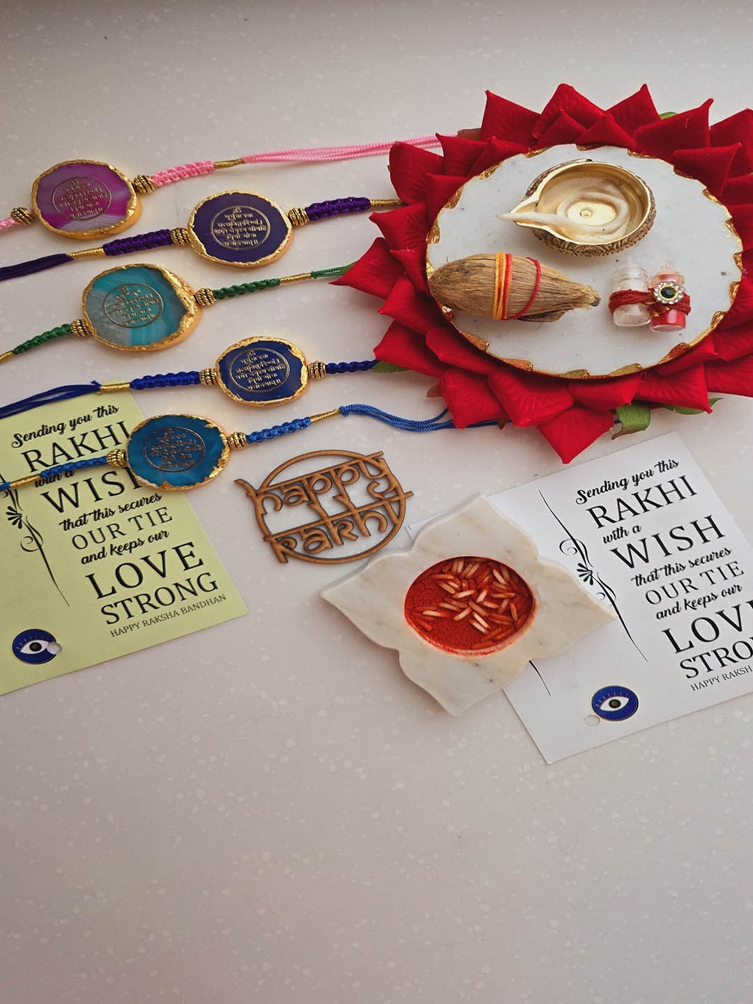 

HOMEARTE Agate Stone Designer Thread Rakhi With Greeting Card & Roli Chawal, Blue
