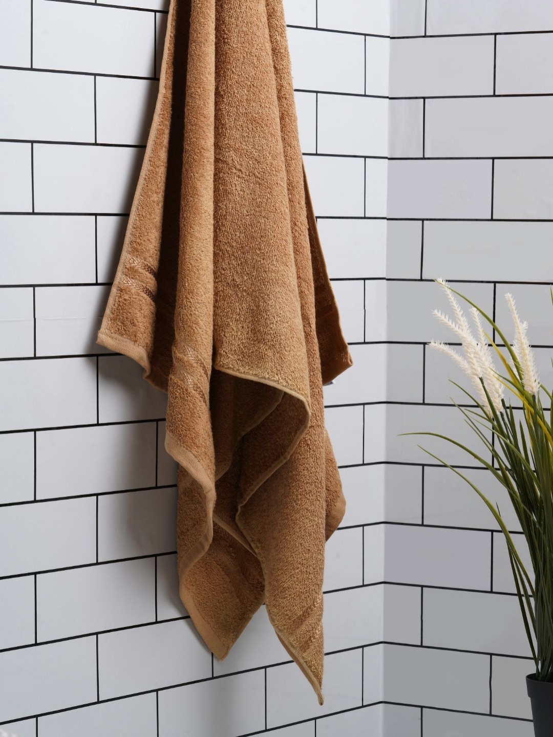 

Welspun Tan Pure Cotton 380 GSM Quick Absorbent Bath Towel