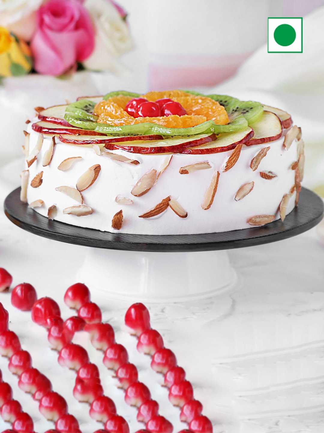 

IGP Fresh Fruit Almond Flavour Eggless Round Cake- 500Gm, White