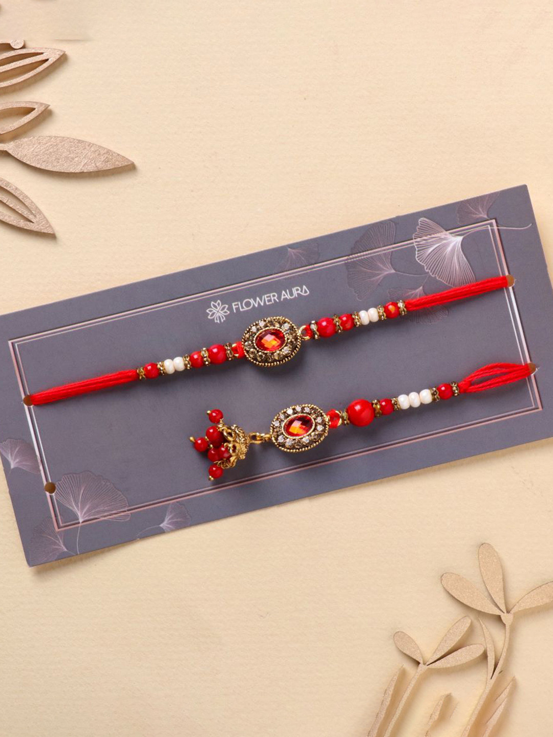

Floweraura Graceful Kundan Bhai and Bhabhi Rakhi Bracelet With Roli Chawal, Red