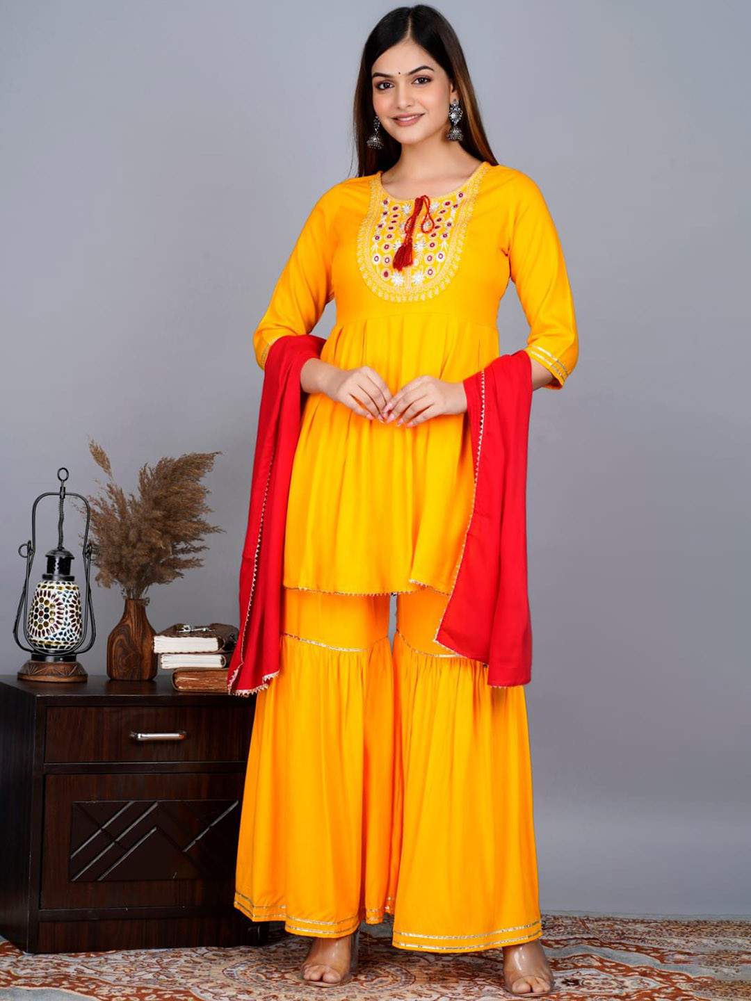 

SHOOLIN Ethnic Motifs Yoke Design Mirror Work A-Line Kurta With Sharara & With Dupatta, Yellow