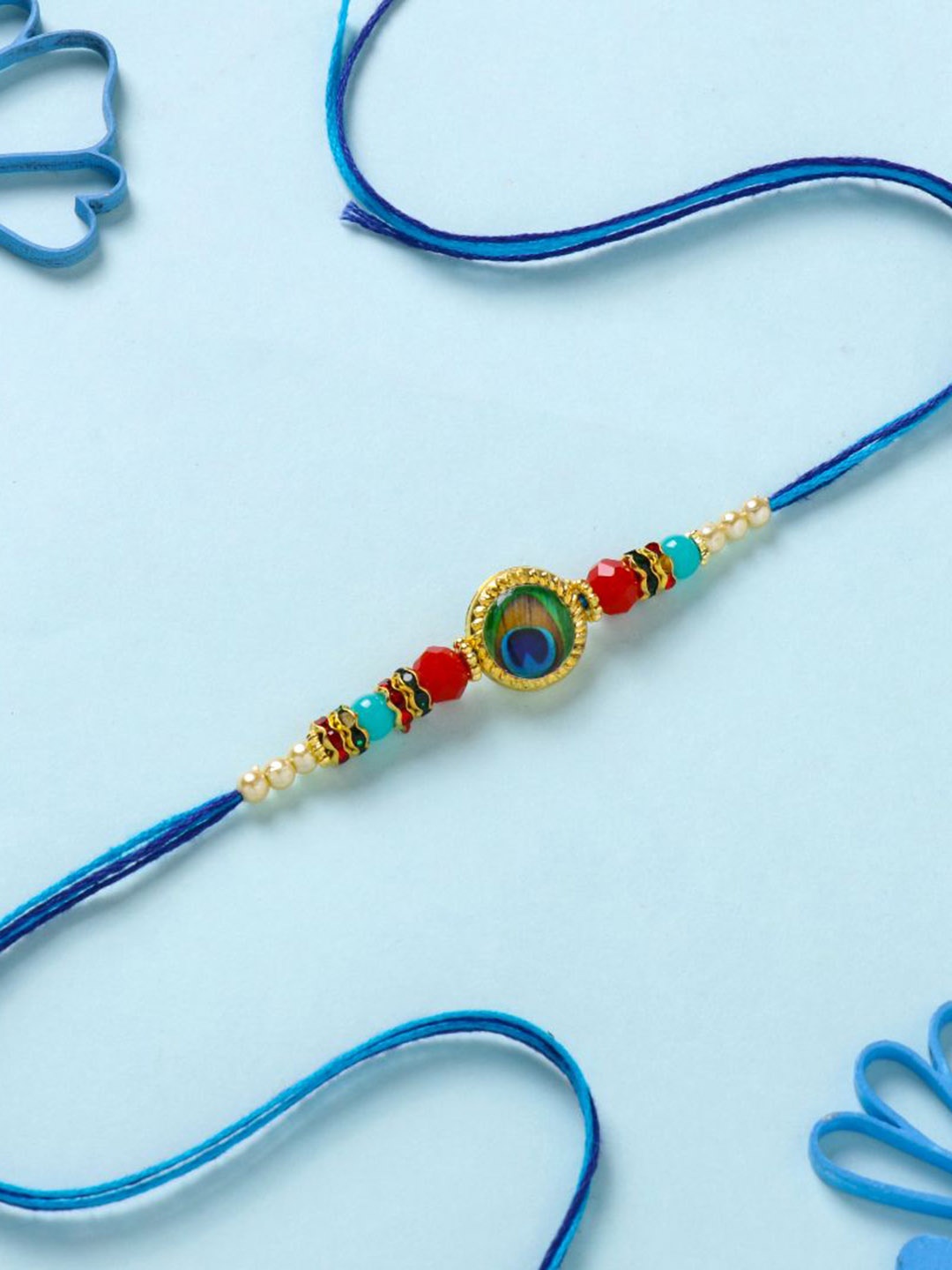 

Floweraura Stone Studded & Beaded Thread Rakhi With Roli Chawal, Blue