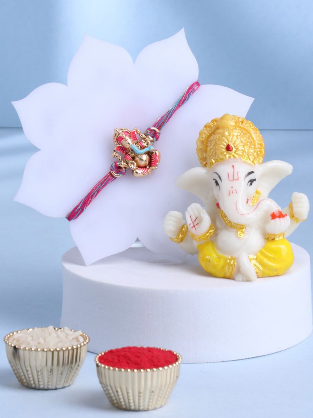 

Floweraura Set of 2 Beaded Rakhi With Lord Ganesha Idol & Roli Chawal, Red