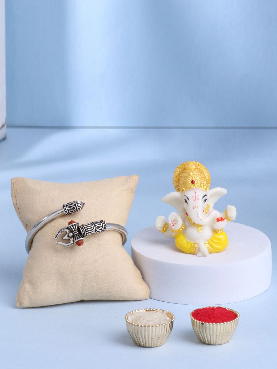 

Floweraura Set Of 2 Om Bracelet Rakhi With Lord Ganesha Idol Gift Set, Silver