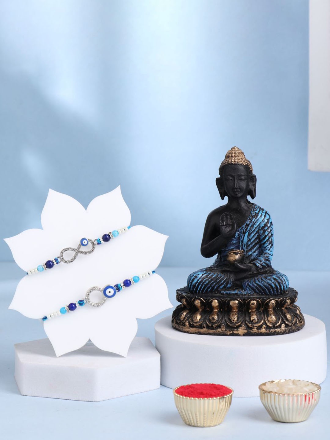 

Floweraura Set of 3 Evil Eye Thread Rakhis Buddha Idol Showpiece & Roli Chawal, Blue