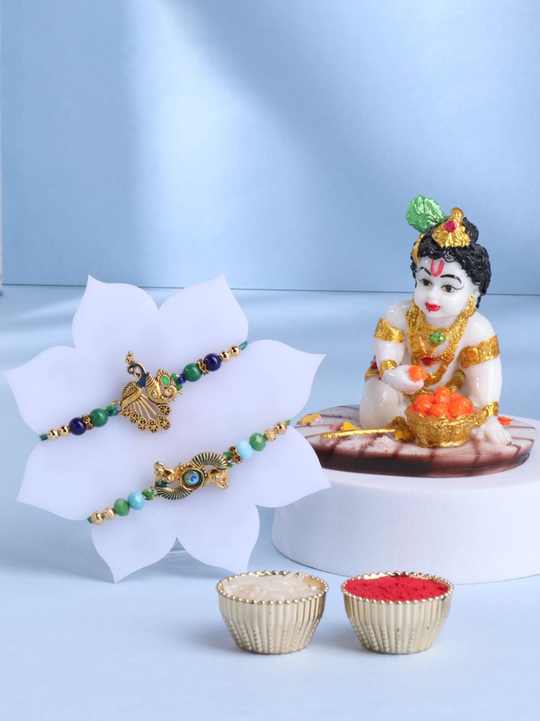 

Floweraura Set Of 3 Beaded Rakhis With Lord Bal Gopal Krishna Idol & Roli Chawal, Gold