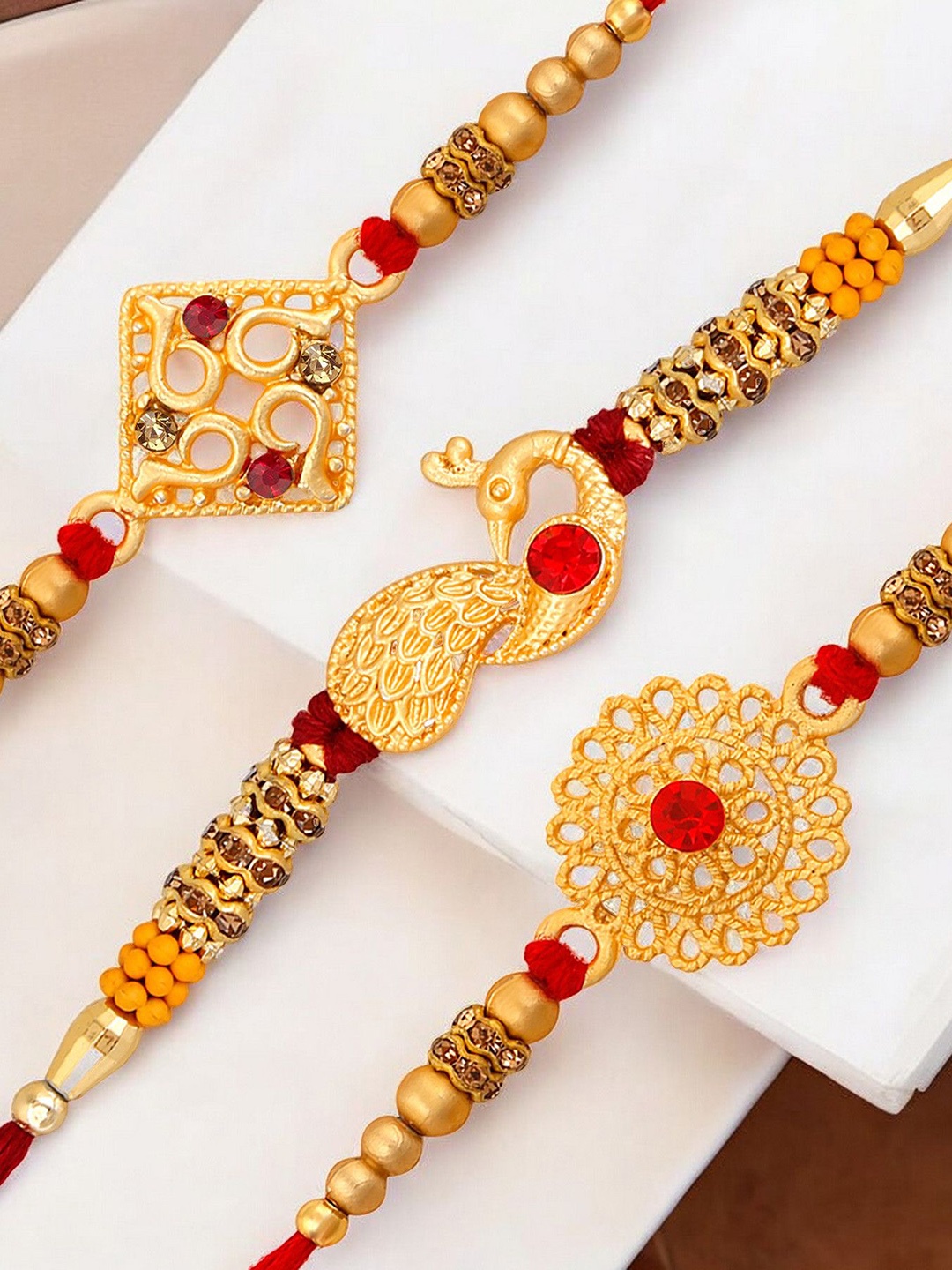 

Okos Set Of 3 Gold Plated Thread Rakhi