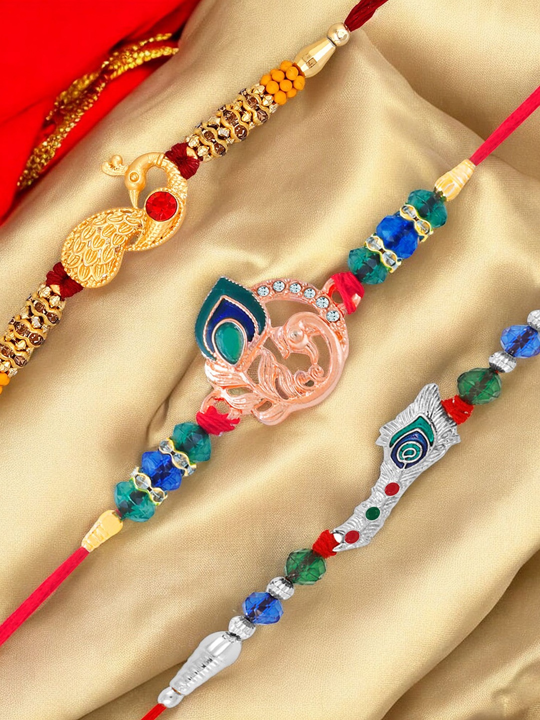 

Okos Set Of 3 Gold Rhodium and Rose Gold Plated Peacock Thread Rakhi