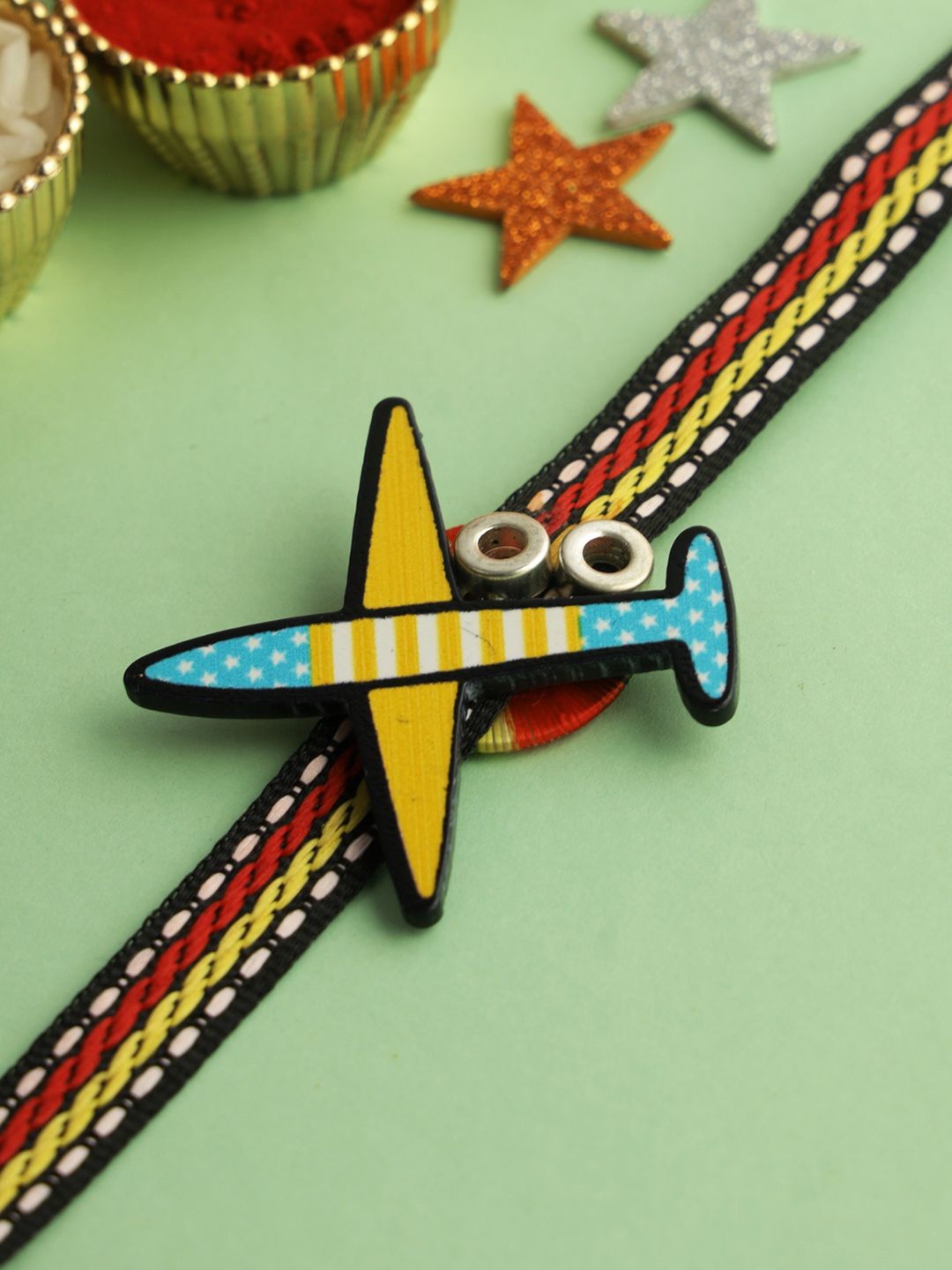 

Kook N Keech Yellow Aeroplane Thread Rakhi With Roli Chawal & Greeting Card