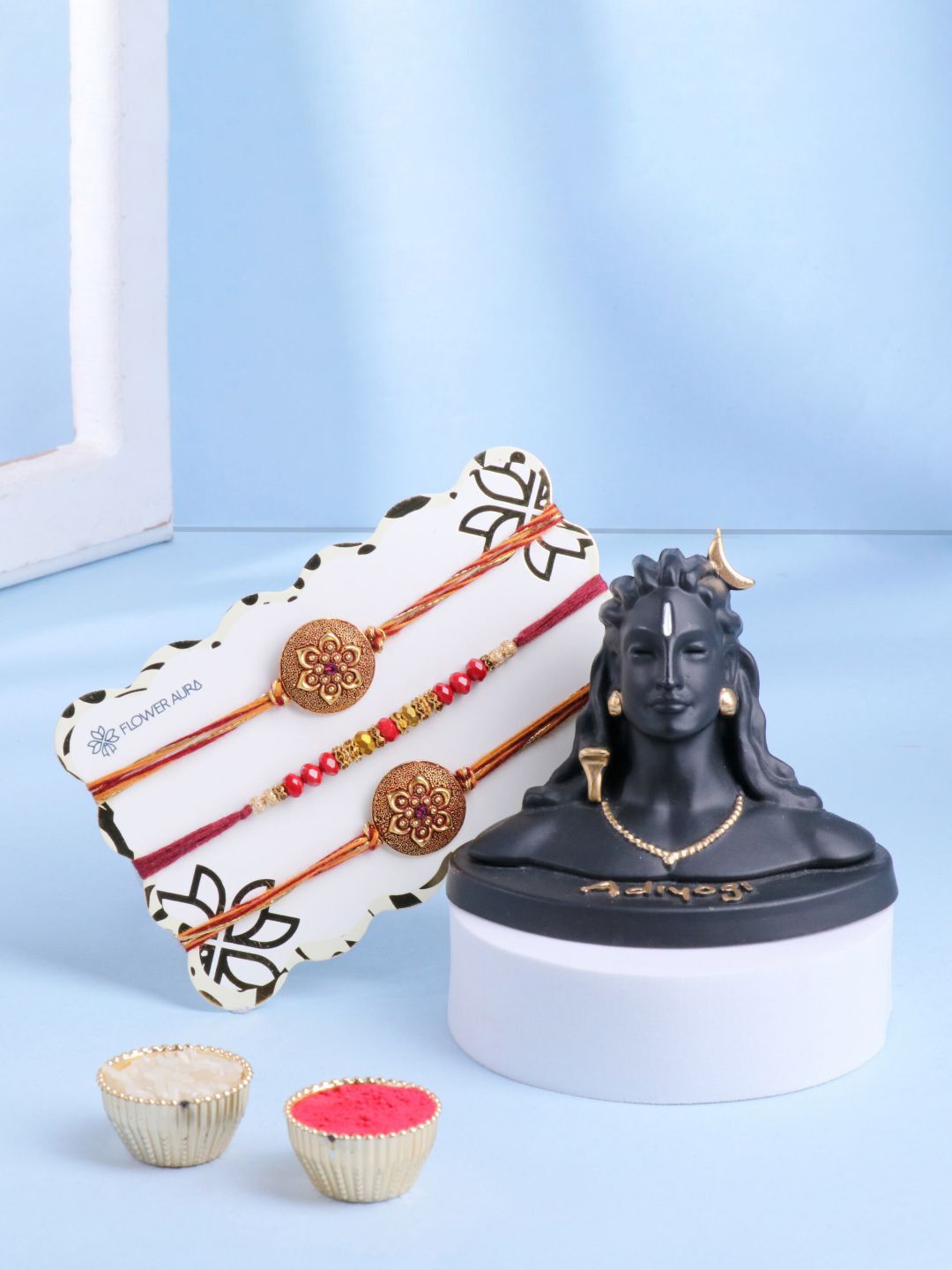 

Floweraura Set Of 4 Thread Rakhis With Lord Shiva Adiyogi Idol & Roli Chawal, Gold