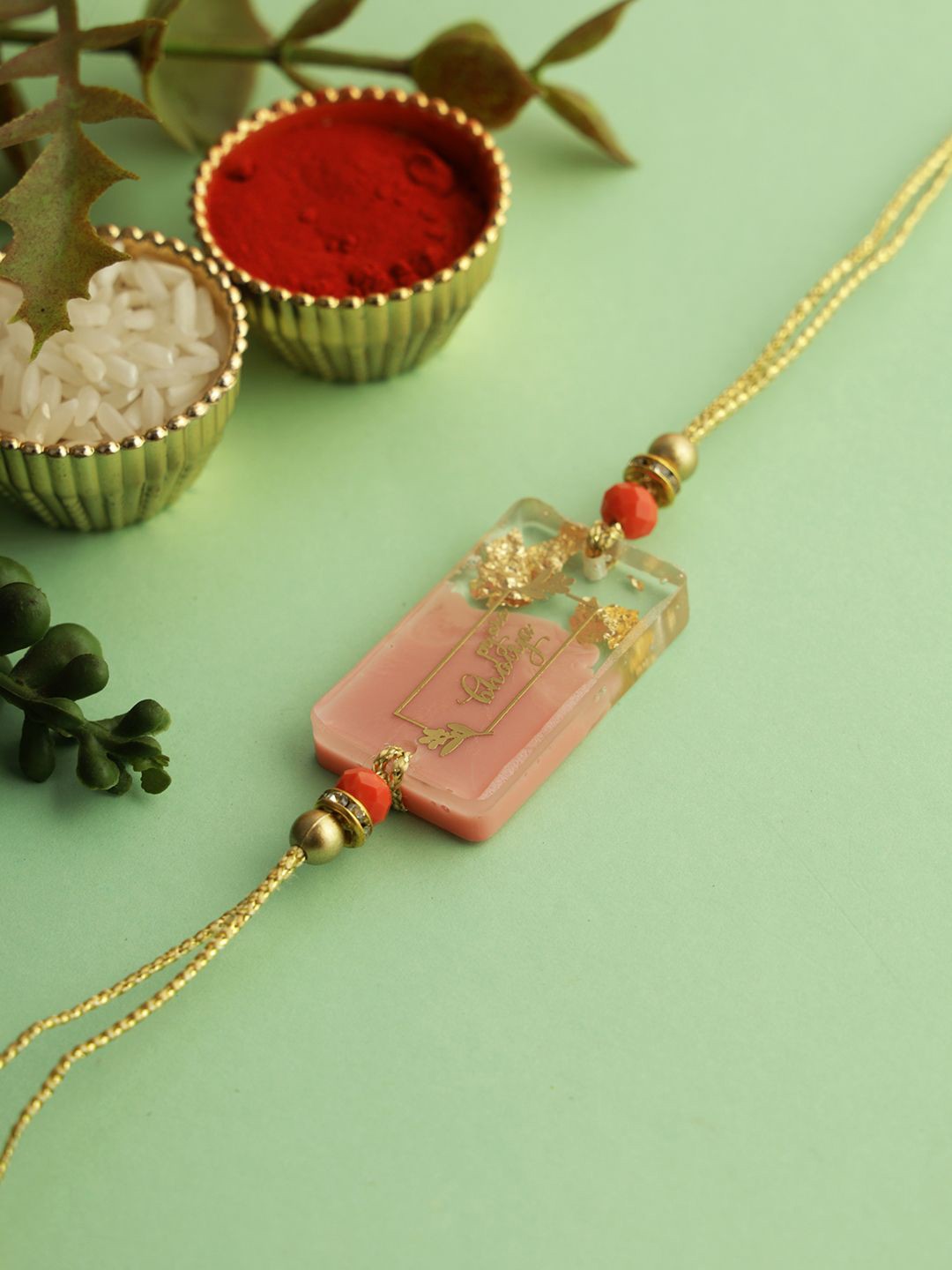 

Sangria Beaded Thread Rakhi with Roli Chawal & Greetings Card, Peach