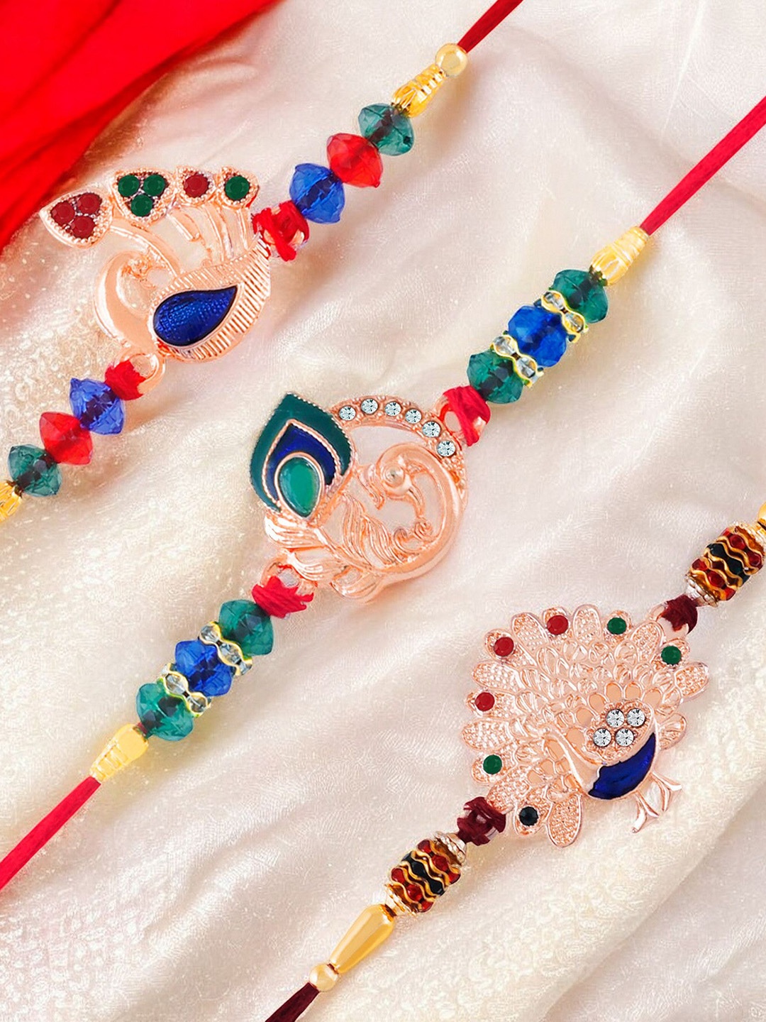 

Okos Set of 3 Beaded Peacock Style Thread Rakhis, Rose gold