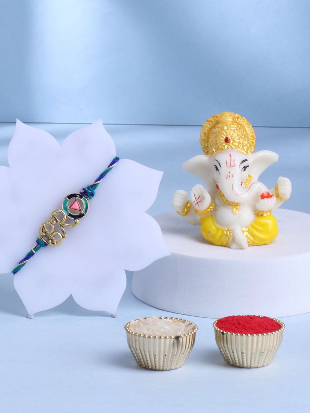 

Floweraura Set of 2 Beaded Rakhi With Lord Ganesha Idol & Roli Chawal, Blue